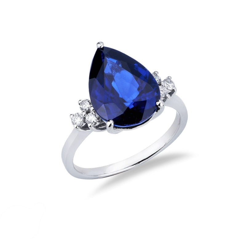Anello Armonia in oro bianco 18k con grande zaffiro blu a goccia e 3 diamanti per lato