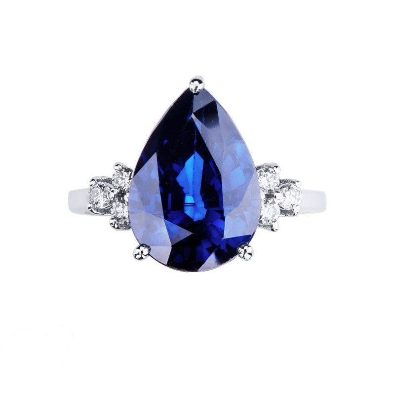 Anello Armonia in oro bianco 18k con grande zaffiro blu a goccia e 3 diamanti per lato