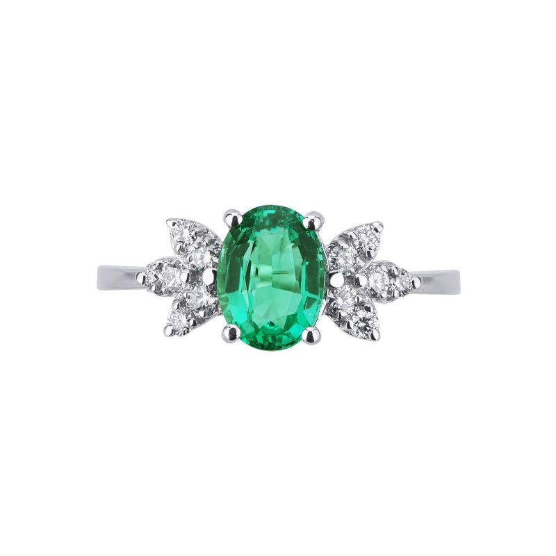 Anello Armonia in Oro bianco 18k con Smeraldo ovale e Diamanti sui lati.